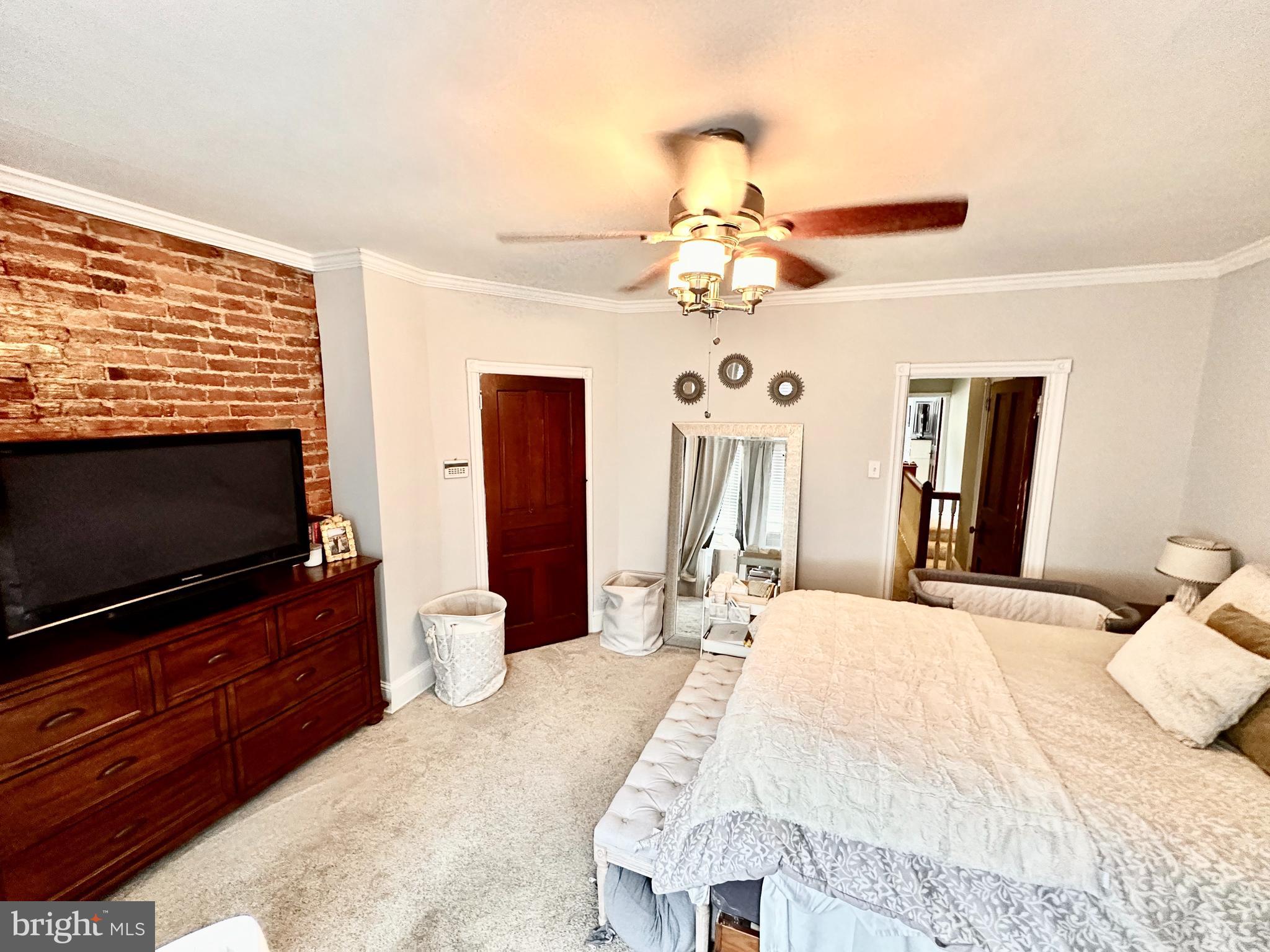 4531 Wilde Street Philadelphia, PA 19127 - Photo 15 of 23 a bedroom with a bed and a flat screen tv