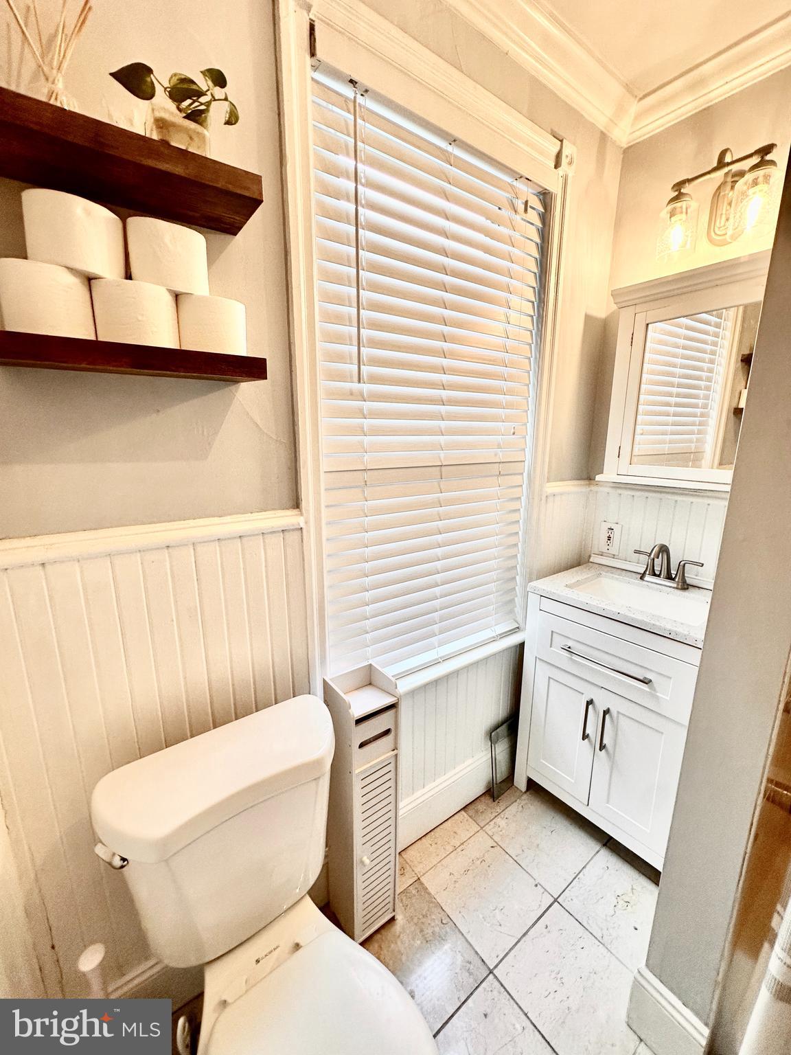 4531 Wilde Street Philadelphia, PA 19127 - Photo 21 of 23 a bathroom with a toilet a sink and a window