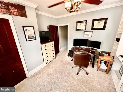 a workspace with furniture and wooden floor