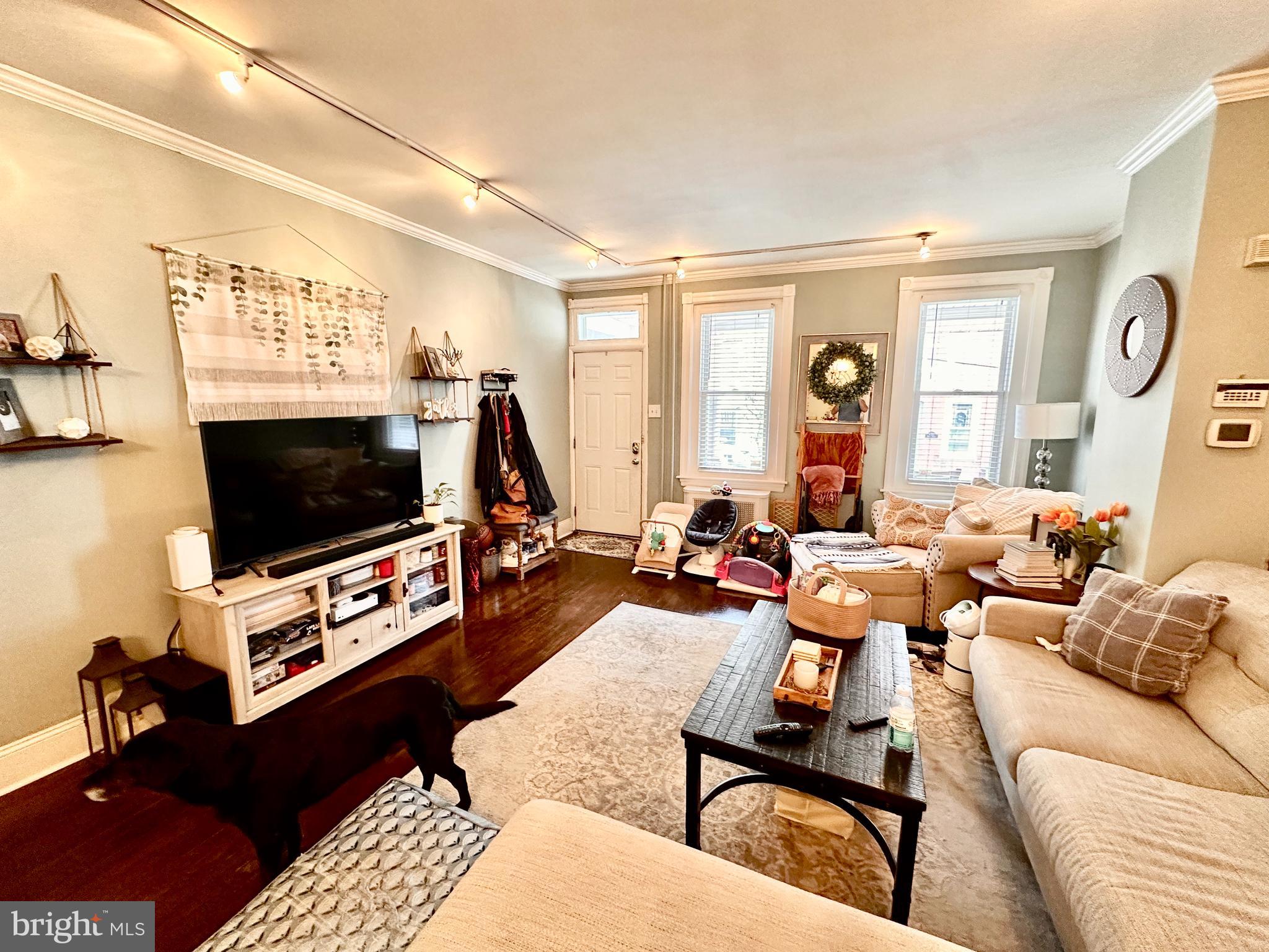 4531 Wilde Street Philadelphia, PA 19127 - Photo 3 of 23 a living room with furniture and a flat screen tv