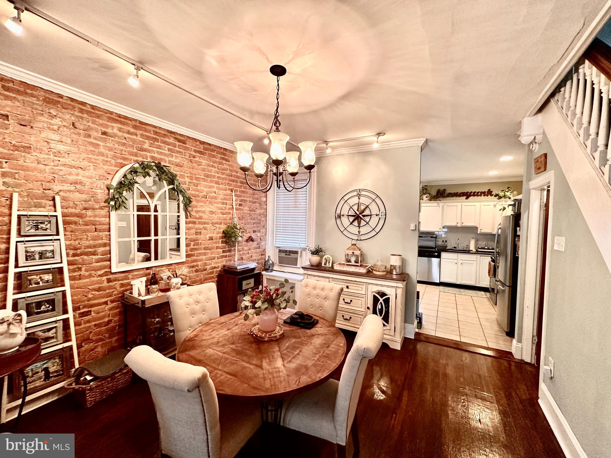 4531 Wilde Street Philadelphia, PA 19127 - Photo 4 of 23 a large kitchen with a table and chairs