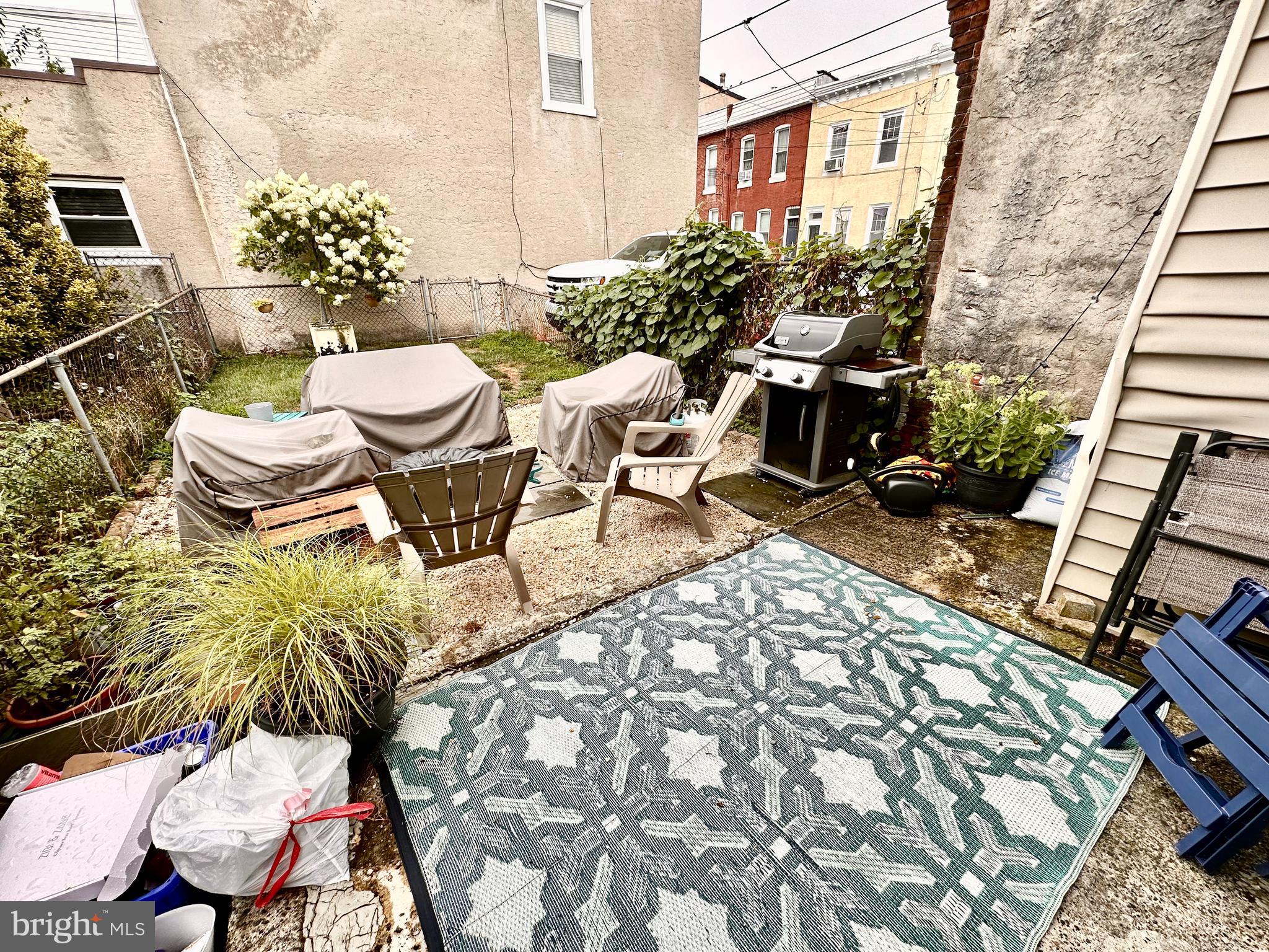 4531 Wilde Street Philadelphia, PA 19127 - Photo 10 of 23 a view of a chairs and table in backyard