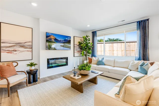 a living room with furniture and a large window