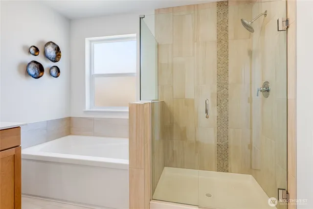 a bathroom with a bathtub and a shower