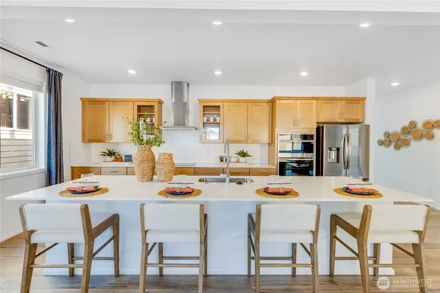 a kitchen with a table and chairs in it