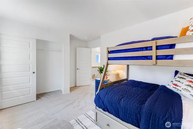 a bedroom with a bed and a closet