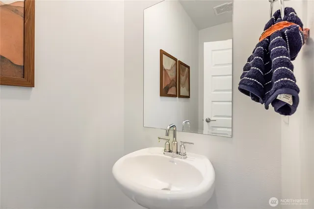 a bathroom with a sink and mirror