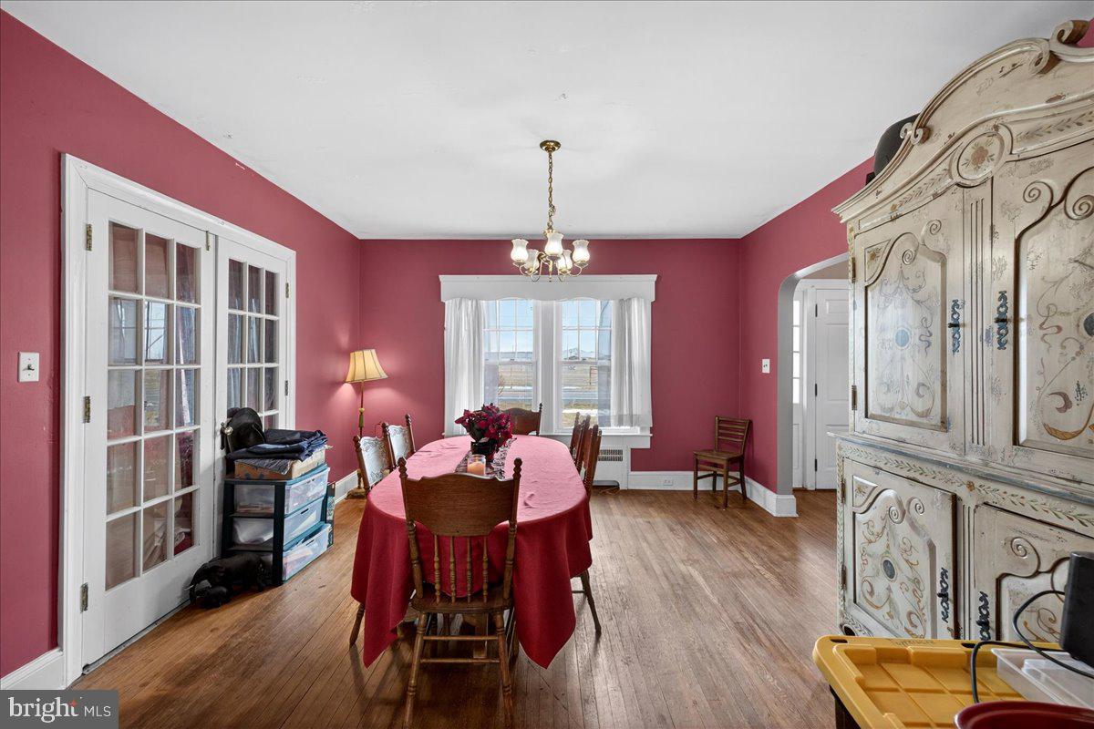 32076 Gordy Road Laurel, DE 19956 - Photo 18 of 26 a dining room with furniture window and wooden floor