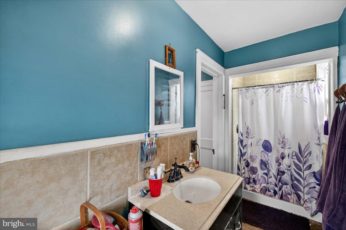 32076 Gordy Road Laurel, DE 19956 - Photo 22 of 26 a bathroom with a sink and a mirror