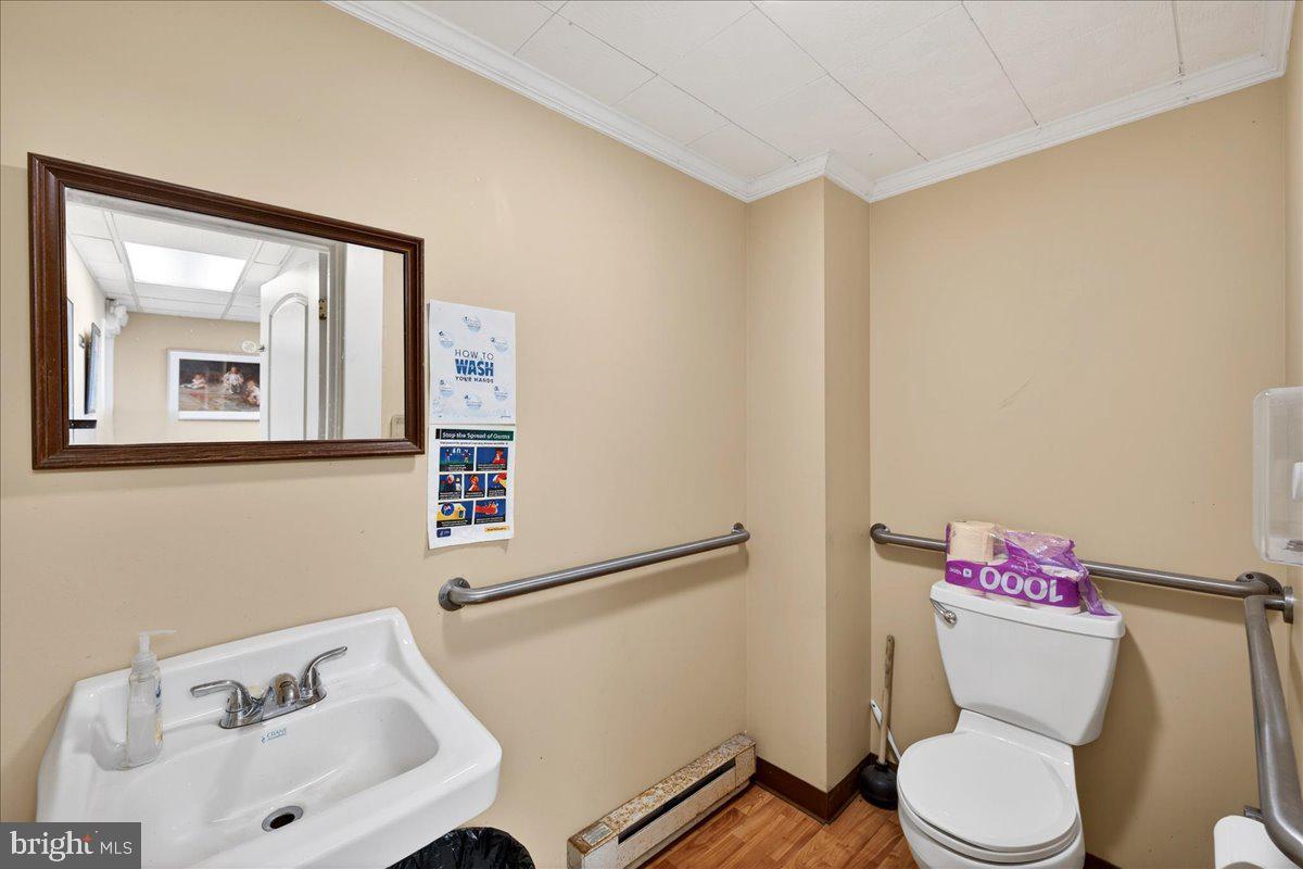 32076 Gordy Road Laurel, DE 19956 - Photo 23 of 26 a white toilet sitting next to a bathroom sink