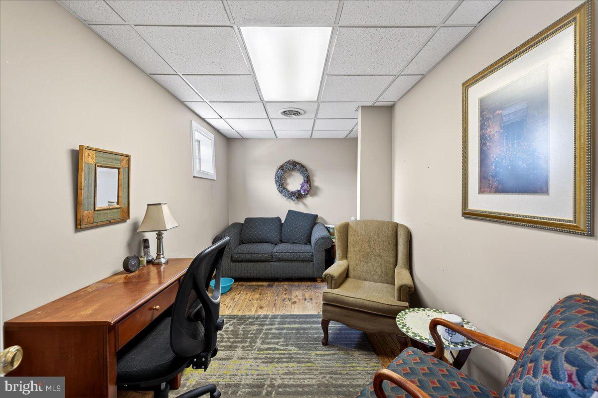 32076 Gordy Road Laurel, DE 19956 - Photo 24 of 26 a living room with furniture and a chandelier