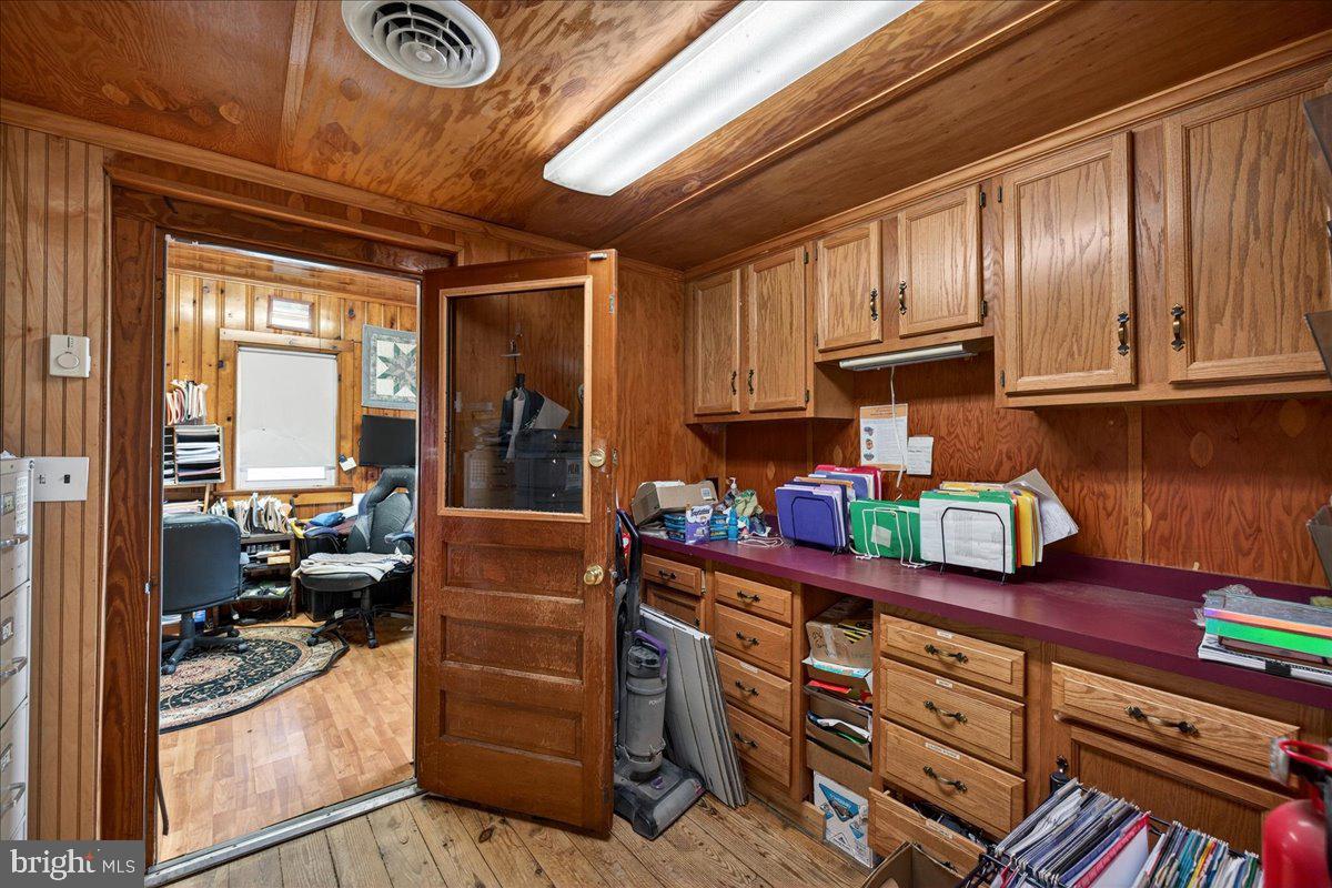 32076 Gordy Road Laurel, DE 19956 - Photo 25 of 26 a kitchen with granite countertop wooden cabinets and stainless steel appliances