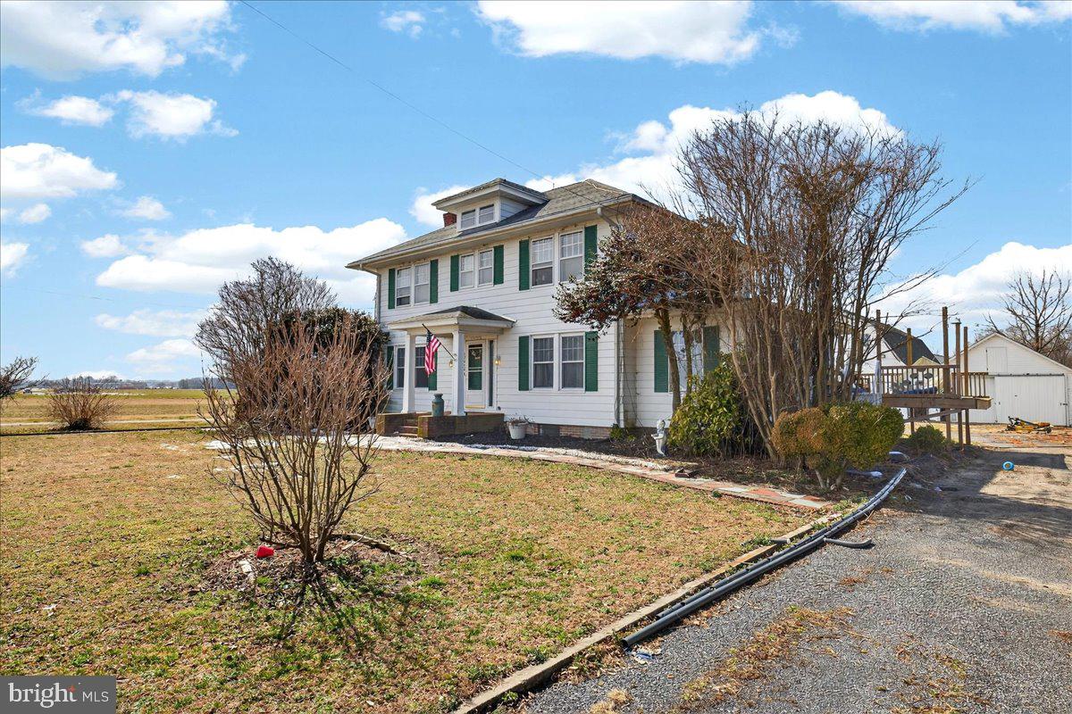 32076 Gordy Road Laurel, DE 19956 - Photo 7 of 26 a front view of a house with a yard