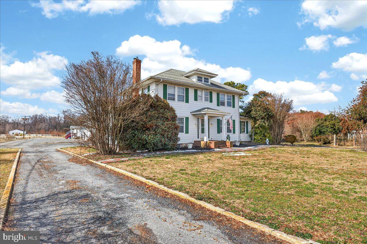 32076 Gordy Road Laurel, DE 19956 - Photo 9 of 26 a front view of house with yard and trees
