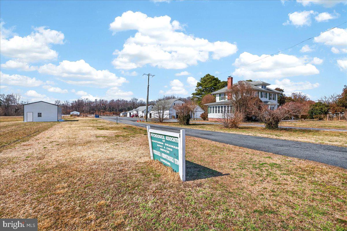 32076 Gordy Road Laurel, DE 19956 - Photo 10 of 26 a view of a swimming pool with a lawn chairs