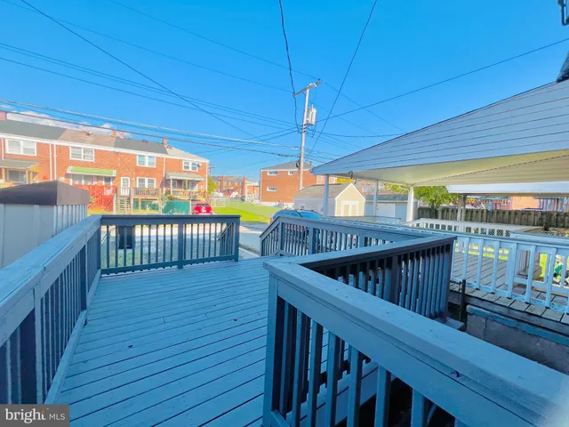 a view of a balcony with wooden floor