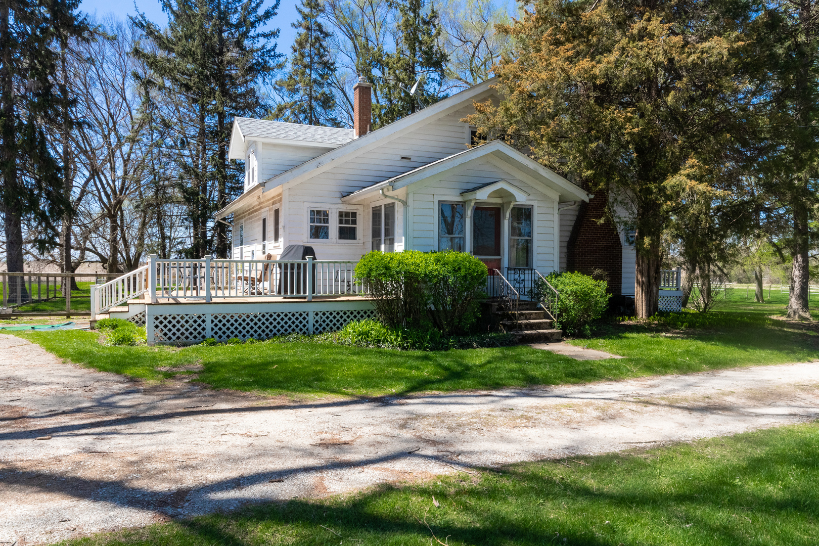 42W671 Jericho Road Sugar Grove, IL 60554 - Photo 2 of 31 a front view of a house with a yard and potted plants