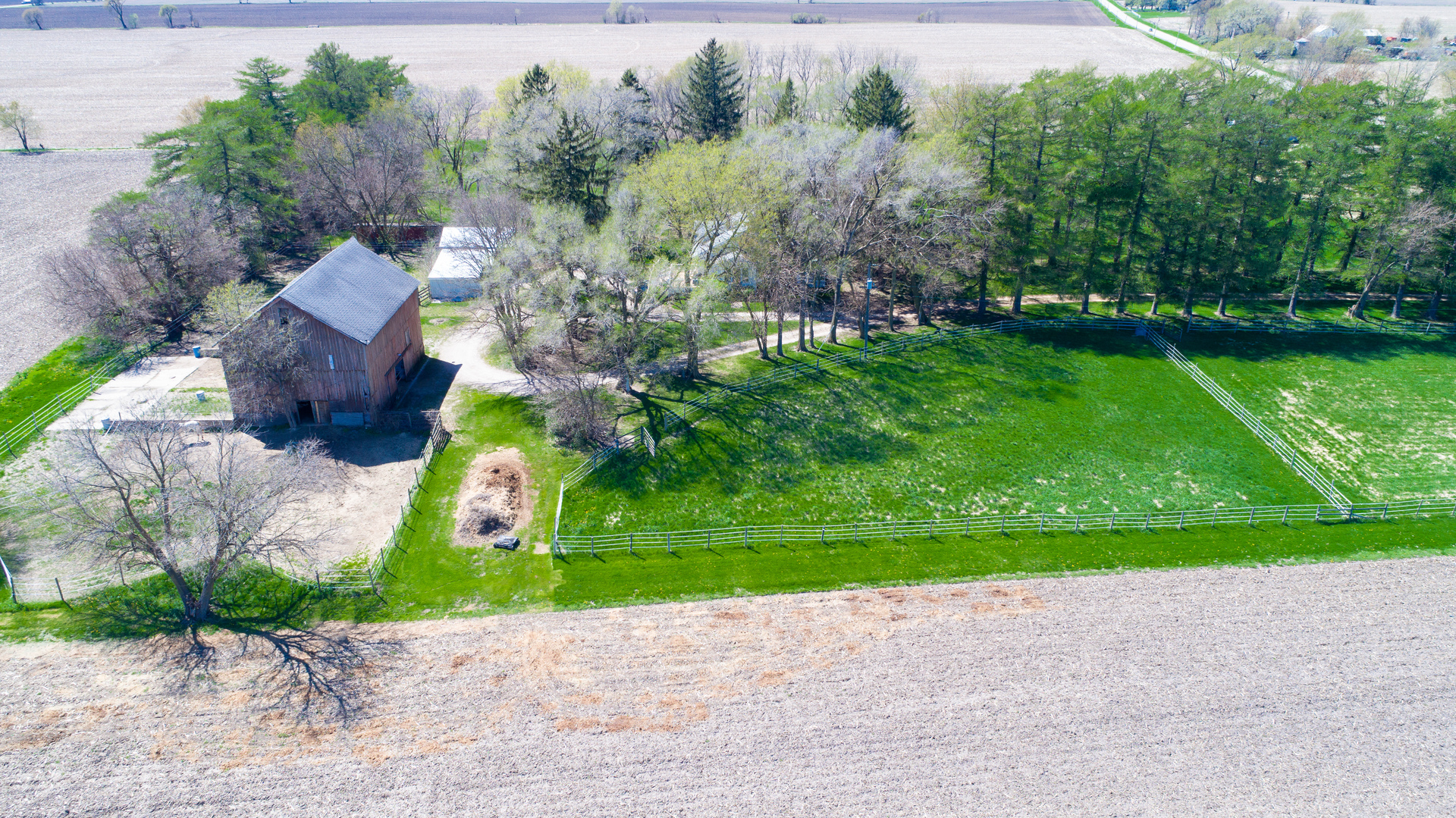 42W671 Jericho Road Sugar Grove, IL 60554 - Photo 15 of 31 a green field with some trees in the background
