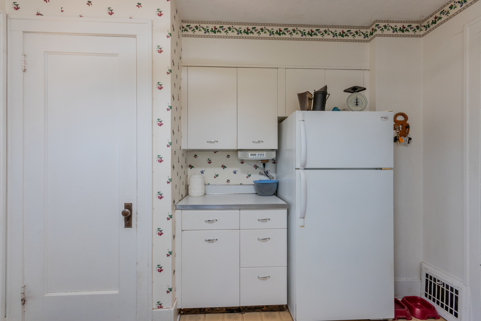 42W671 Jericho Road Sugar Grove, IL 60554 - Photo 27 of 31 a kitchen with a refrigerator and white cabinets
