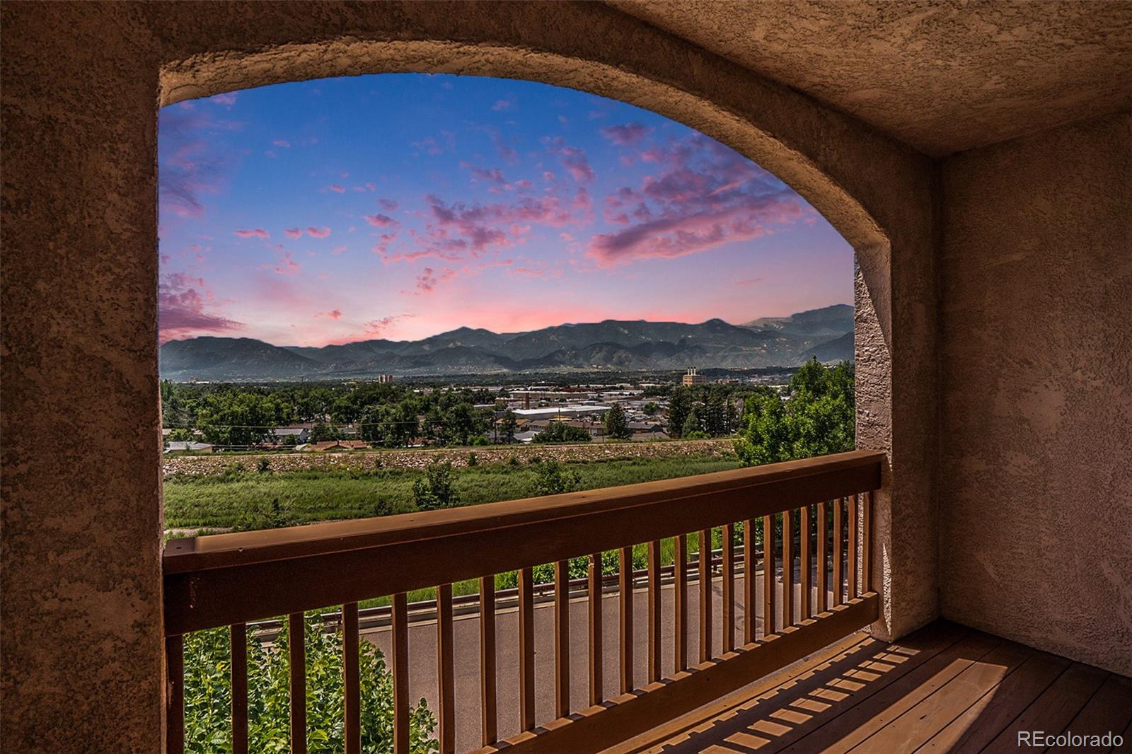 1131 Westmoreland Road Colorado Springs, CO 80907 - Photo 1 of 30 a view of a city from a balcony