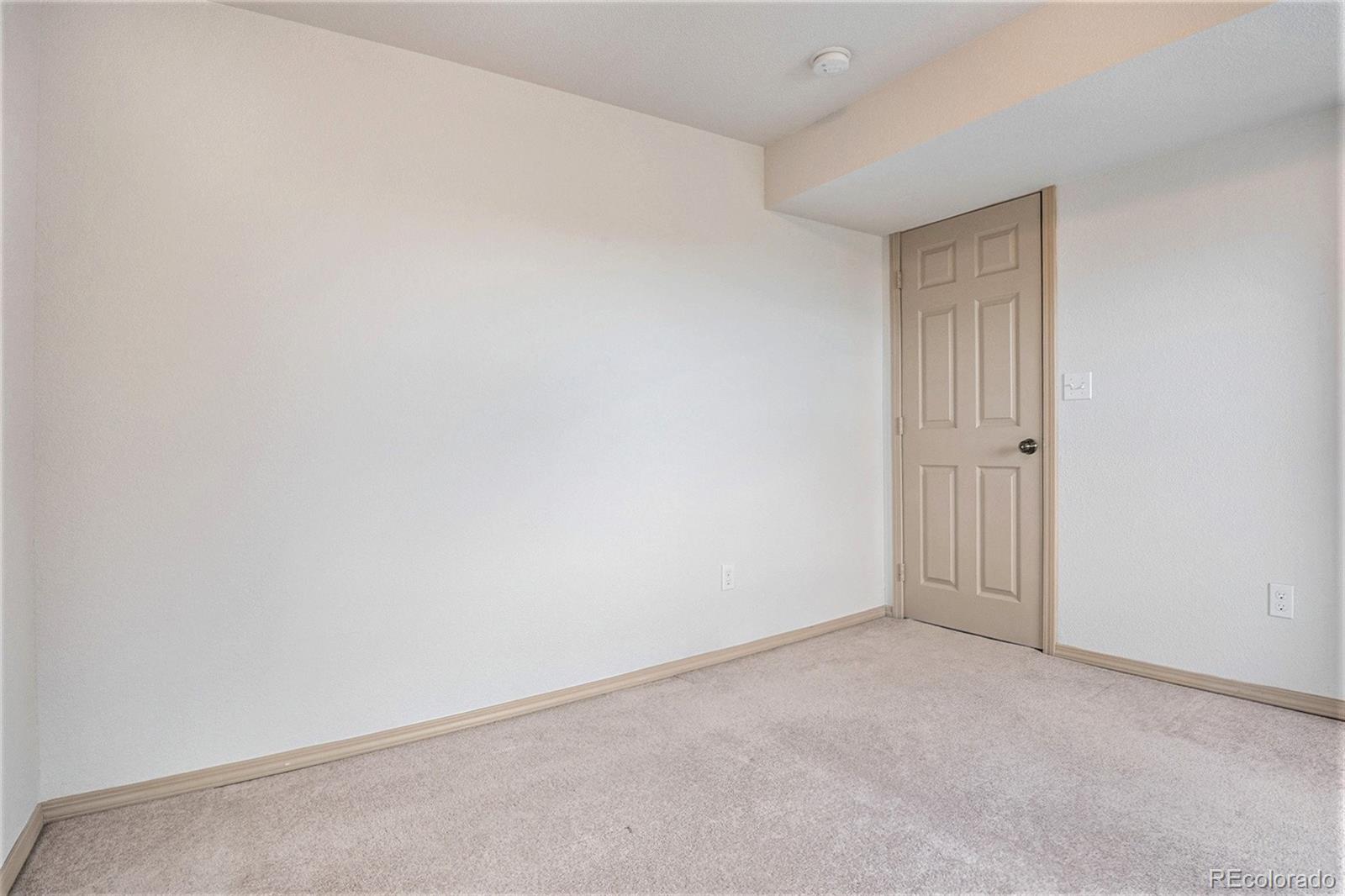 1131 Westmoreland Road Colorado Springs, CO 80907 - Photo 14 of 30 an empty room with an entryway