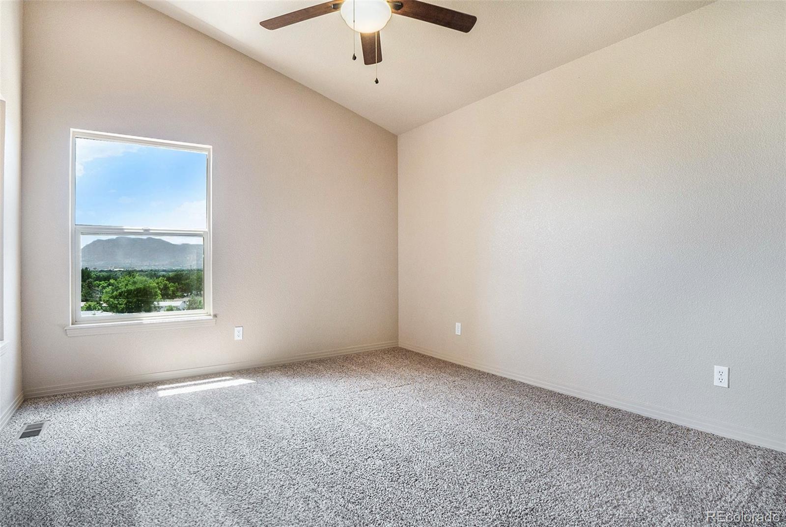 1131 Westmoreland Road Colorado Springs, CO 80907 - Photo 16 of 30 an empty room with windows