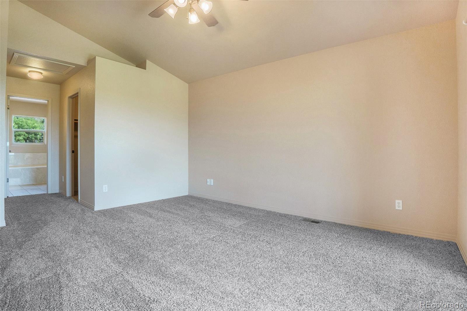 1131 Westmoreland Road Colorado Springs, CO 80907 - Photo 19 of 30 an empty room with a ceiling fan and closet area