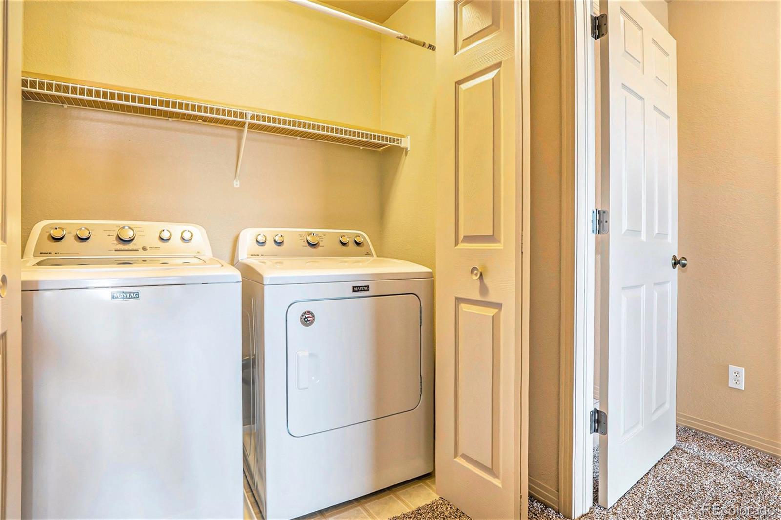 1131 Westmoreland Road Colorado Springs, CO 80907 - Photo 28 of 30 a utility room with dryer and washer