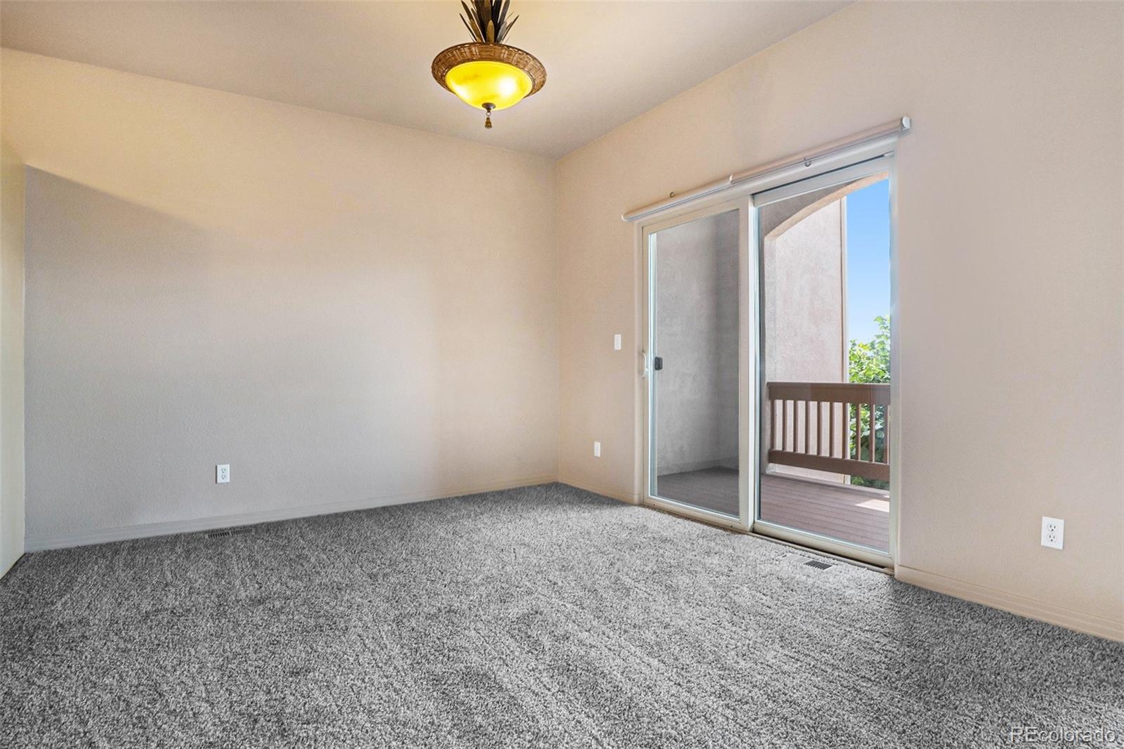 1131 Westmoreland Road Colorado Springs, CO 80907 - Photo 3 of 30 an empty room with a window