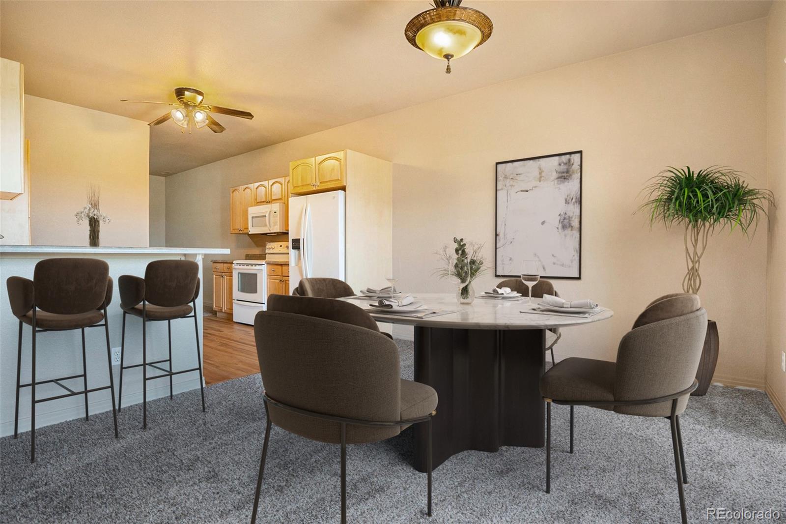 1131 Westmoreland Road Colorado Springs, CO 80907 - Photo 6 of 30 a kitchen with a table and chairs in it