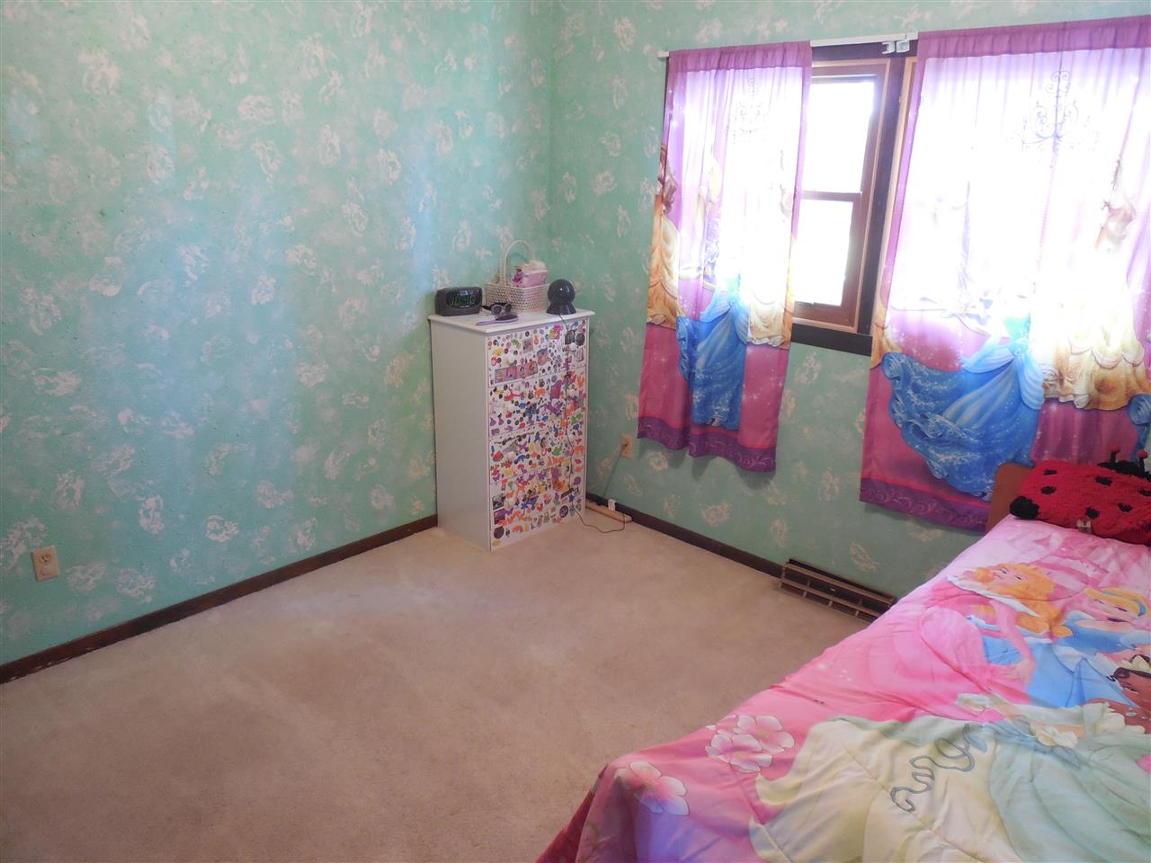 7084 Ralph Road Rockford, IL 61109 - Photo 14 of 21 a bedroom with a bed and a window