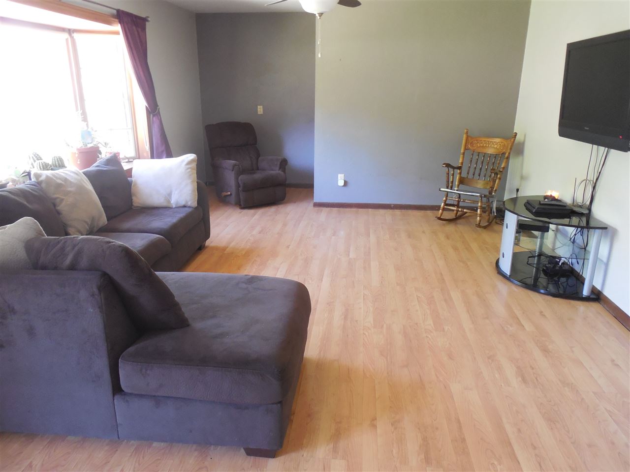 7084 Ralph Road Rockford, IL 61109 - Photo 3 of 21 a living room with furniture and a flat screen tv