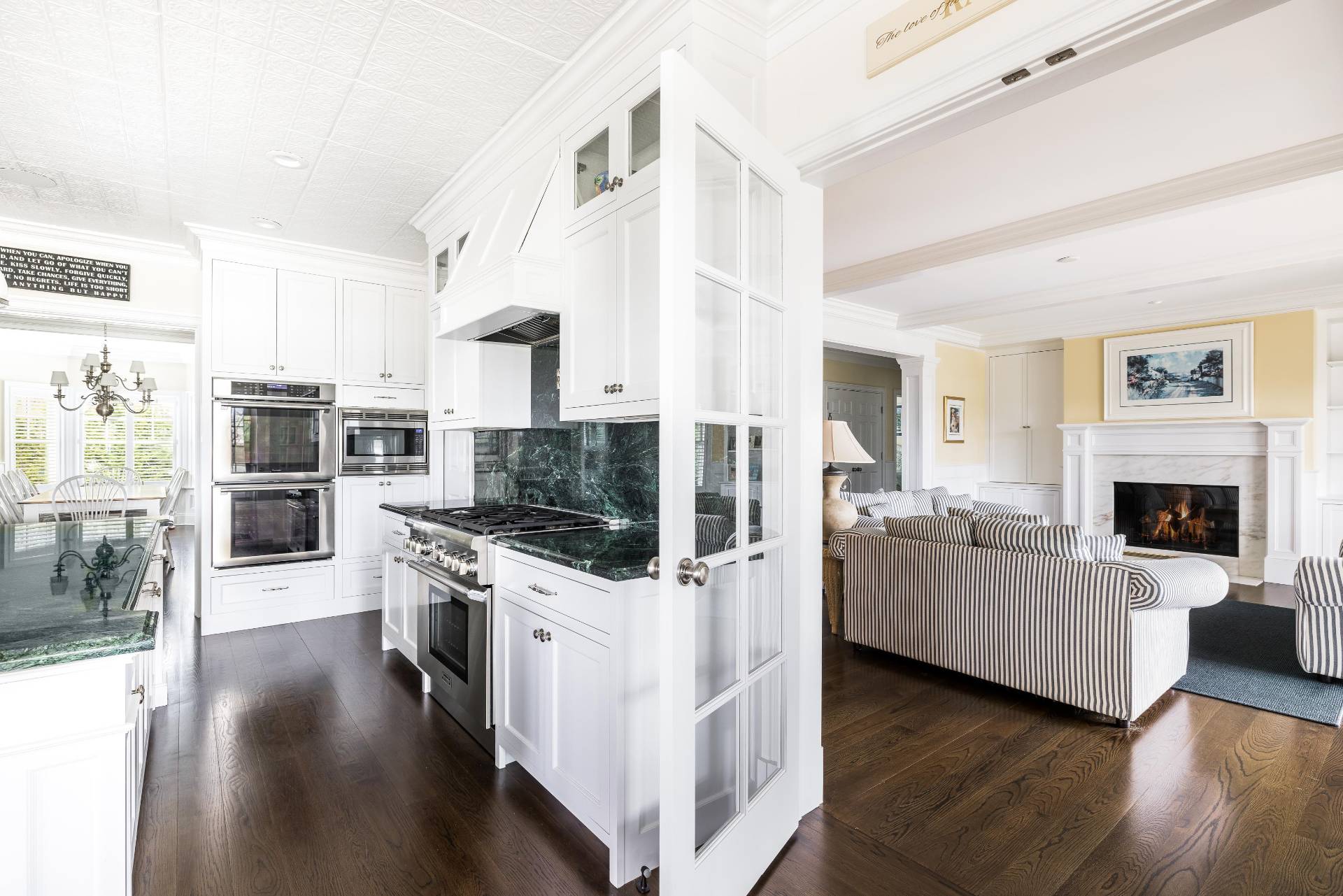 28 Bay Road Quogue, NY 11959 - Photo 11 of 35 a living room with furniture a flat screen tv and a fireplace