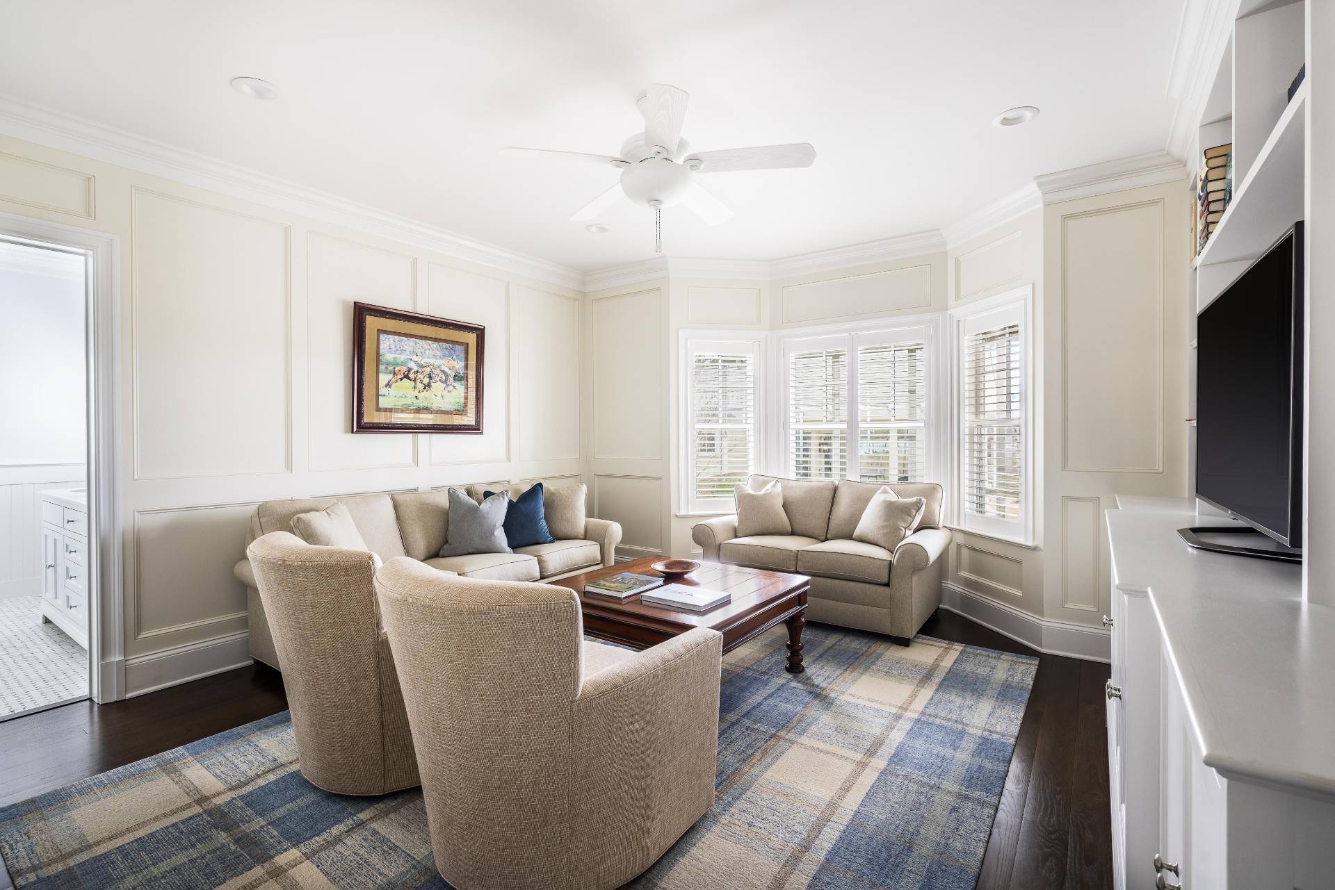28 Bay Road Quogue, NY 11959 - Photo 13 of 35 a living room with furniture a flat screen tv and a window