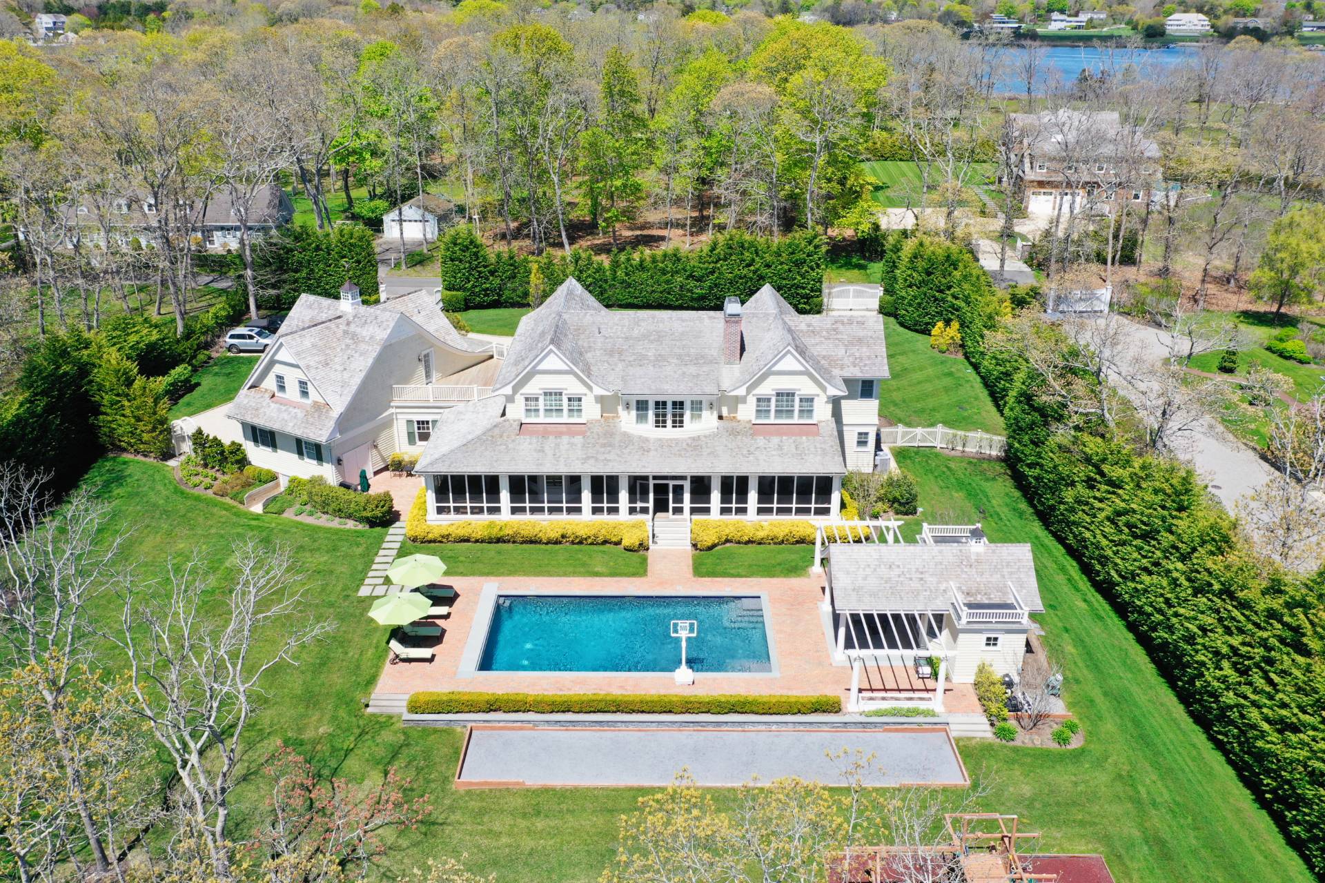 28 Bay Road Quogue, NY 11959 - Photo 3 of 35 an aerial view of residential houses with yard and lake view