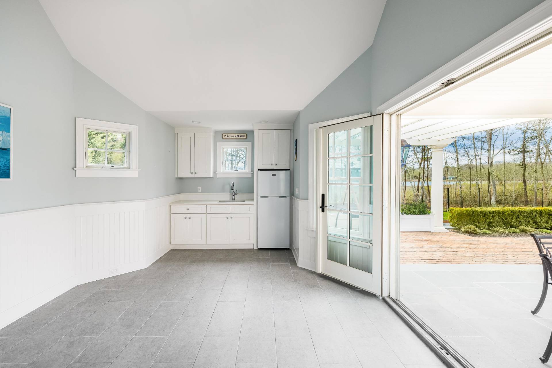 28 Bay Road Quogue, NY 11959 - Photo 31 of 35 a view of a kitchen with a sink and dishwasher with a large window