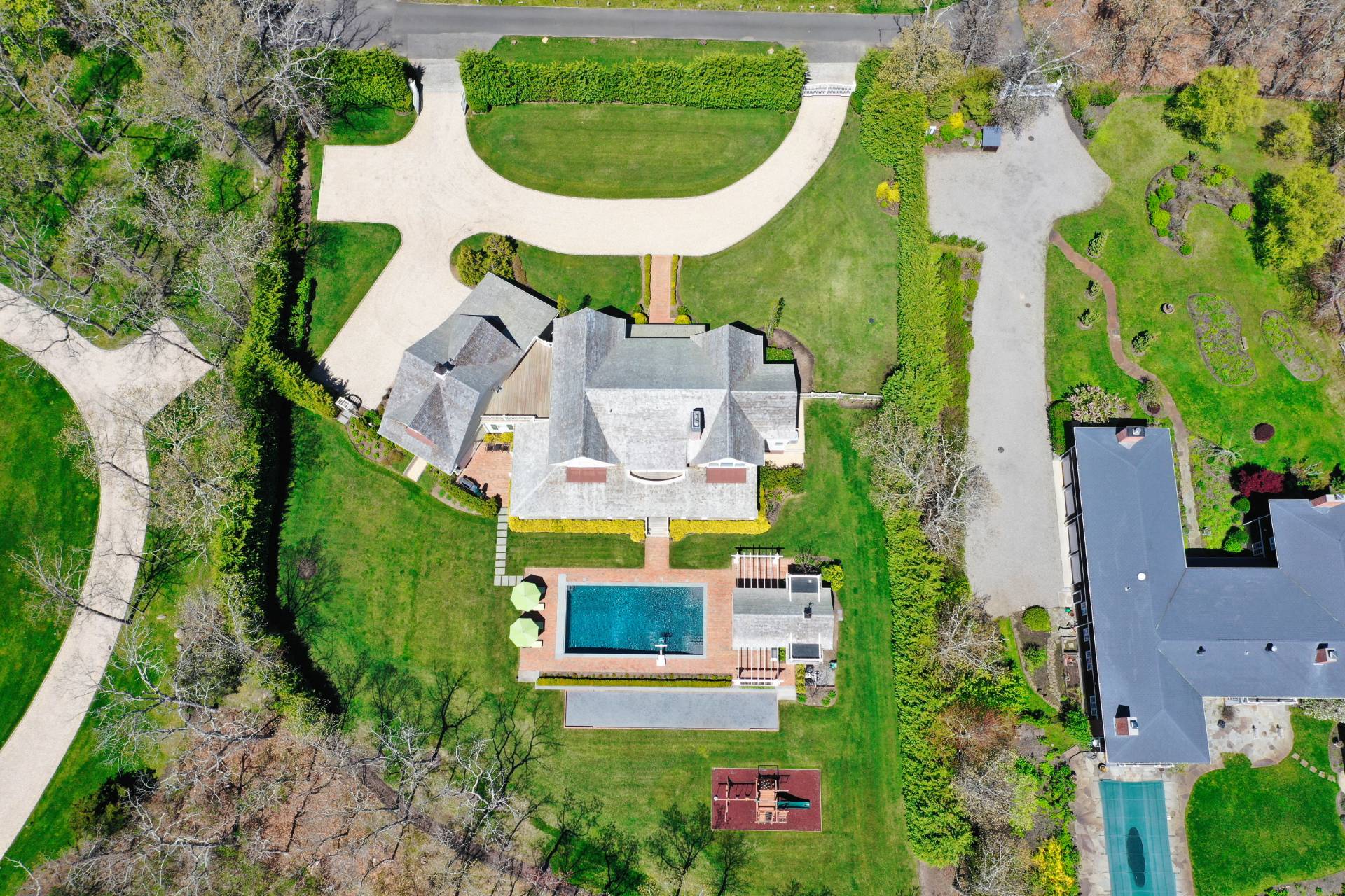 28 Bay Road Quogue, NY 11959 - Photo 33 of 35 an aerial view of a house with outdoor space and a swimming pool
