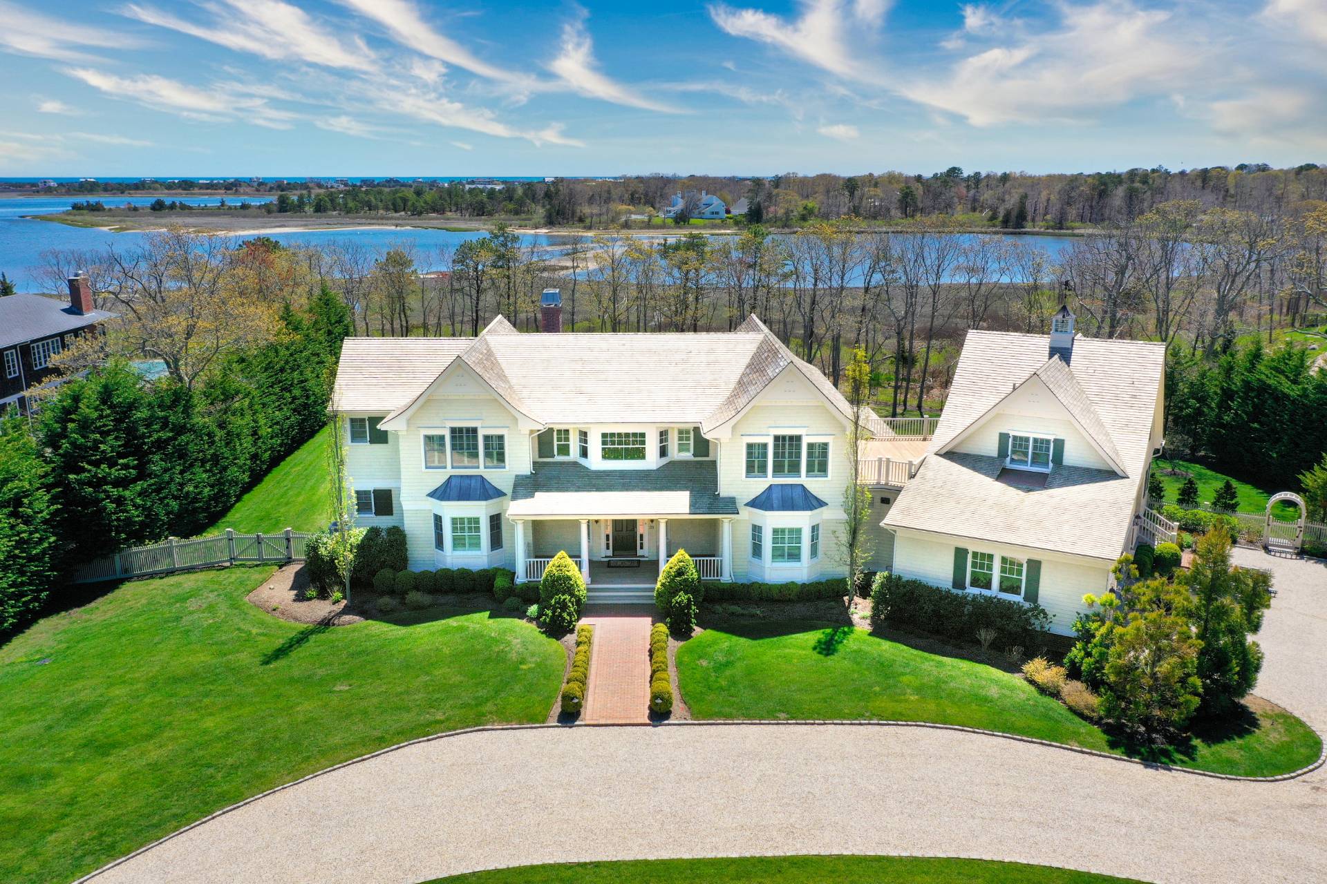28 Bay Road Quogue, NY 11959 - Photo 5 of 35 a view of a house with garden and lake view
