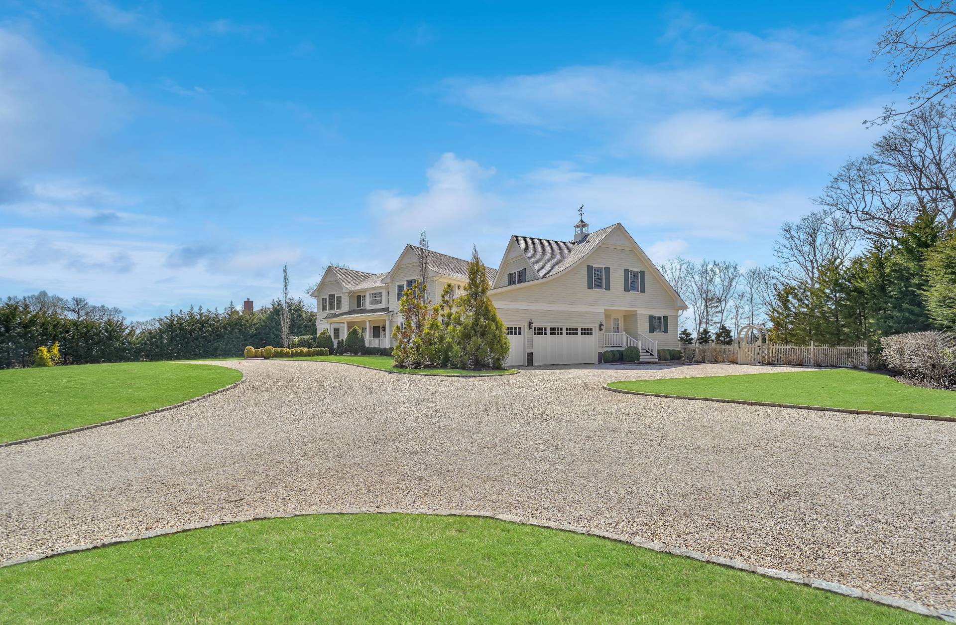 28 Bay Road Quogue, NY 11959 - Photo 7 of 35 a view of a big house with a big yard and large trees