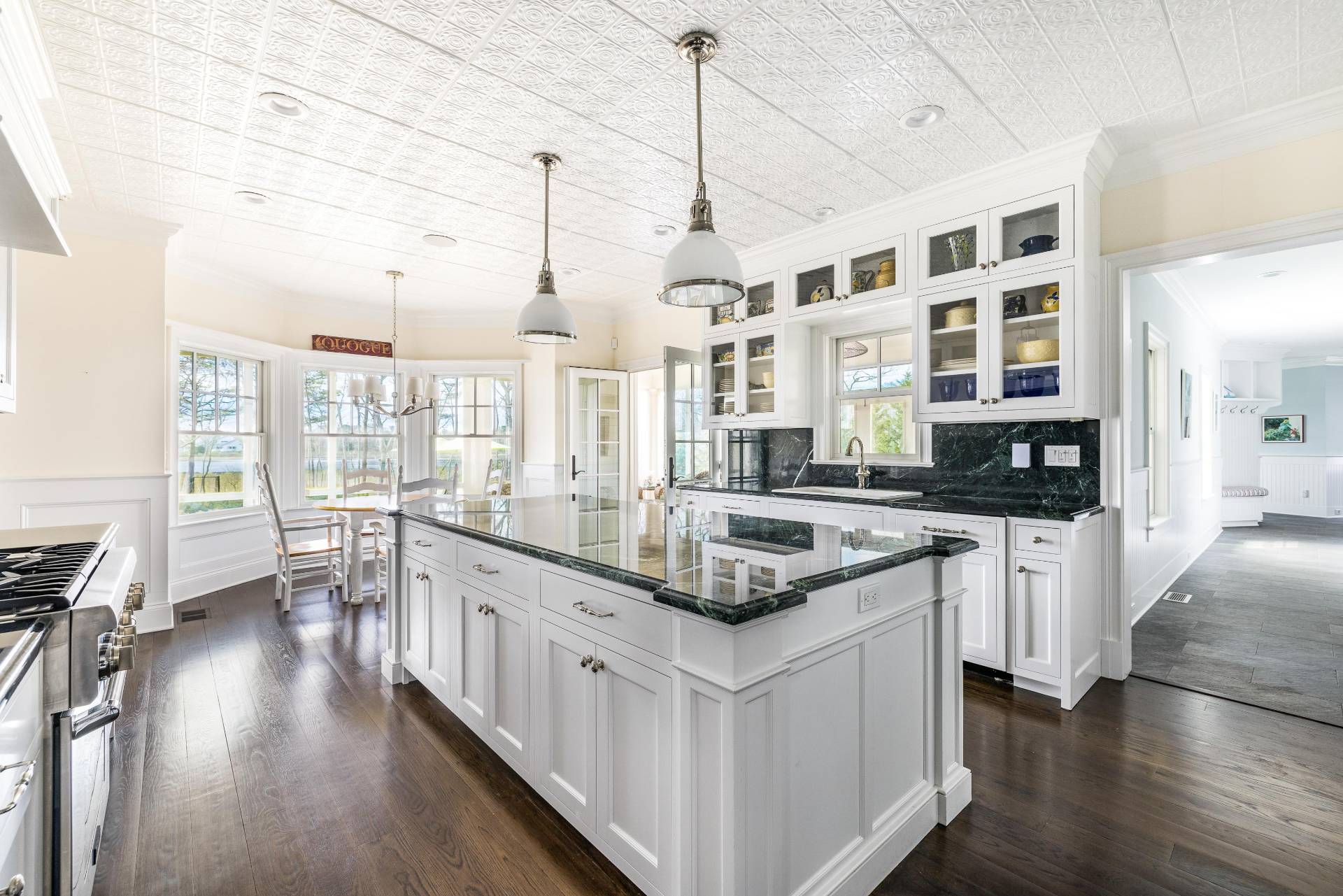 28 Bay Road Quogue, NY 11959 - Photo 10 of 35 a kitchen with stainless steel appliances granite countertop a stove and cabinets