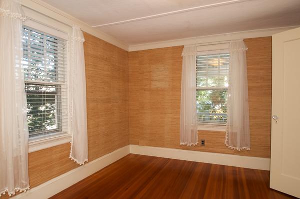 16 Neptune Road Marblehead, MA 01945 - Photo 11 of 22 a view of an empty room with a window and wooden floor