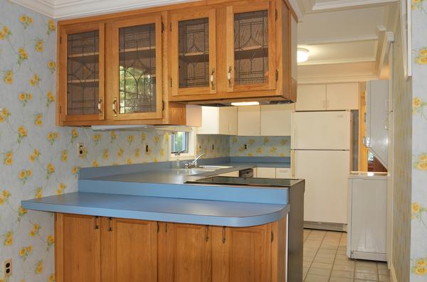 16 Neptune Road Marblehead, MA 01945 - Photo 7 of 22 a kitchen with stainless steel appliances granite countertop a sink stove and refrigerator