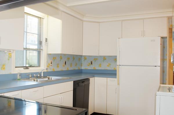 16 Neptune Road Marblehead, MA 01945 - Photo 8 of 22 a kitchen with a sink and a refrigerator