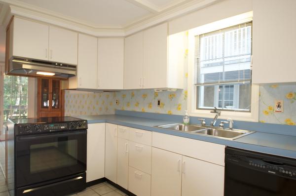 16 Neptune Road Marblehead, MA 01945 - Photo 9 of 22 a kitchen with granite countertop a stove a sink and a window