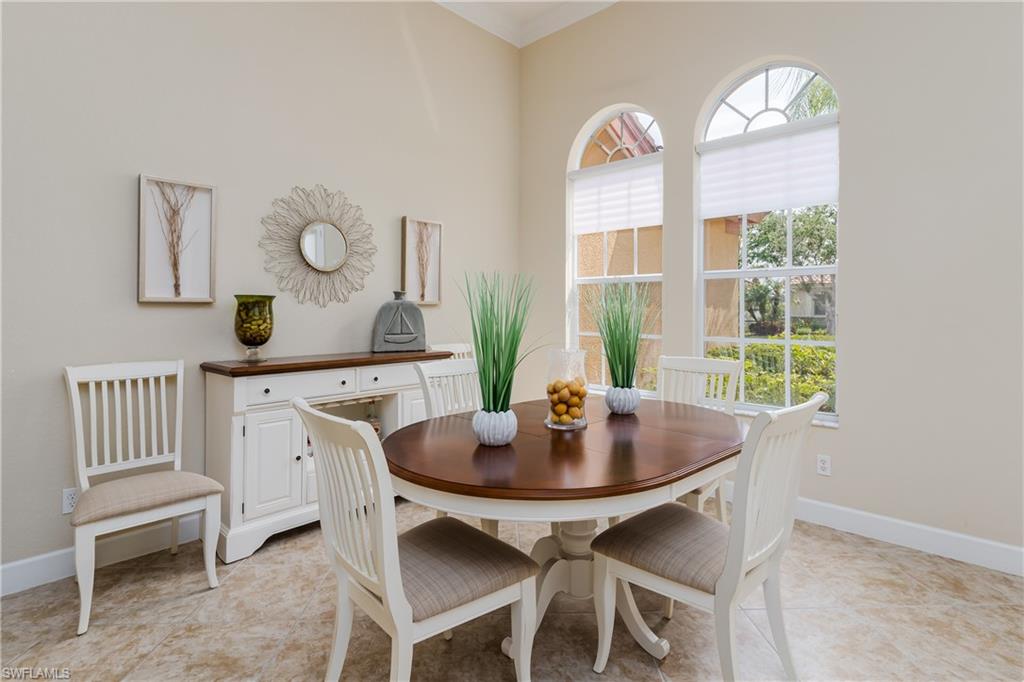 8754 Hideaway Harbor Court Naples, FL 34120 - Photo 15 of 49 a living room with furniture and a window