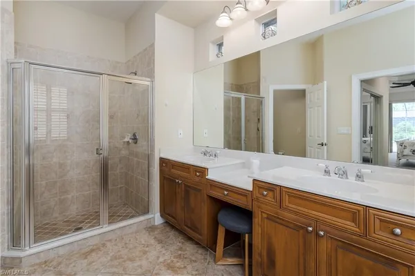 a bathroom with a granite countertop sink mirror and double