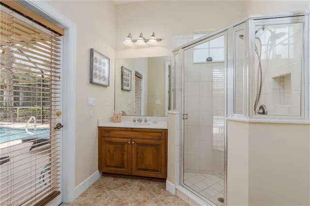 a spacious bathroom with a shower and a sink