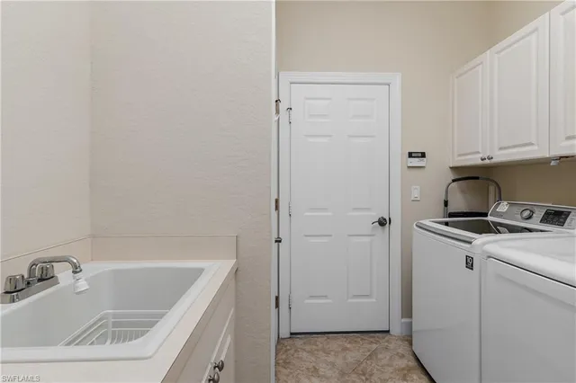 a bathroom with a sink a vanity and tub