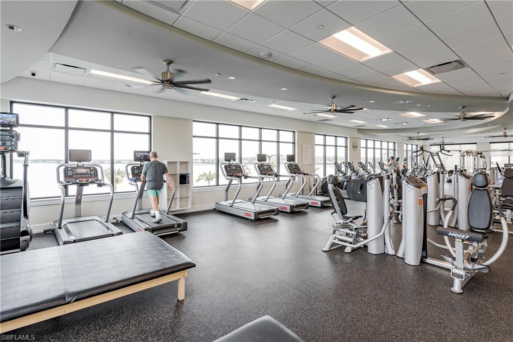 8754 Hideaway Harbor Court Naples, FL 34120 - Photo 35 of 49 a view of a room with gym equipment