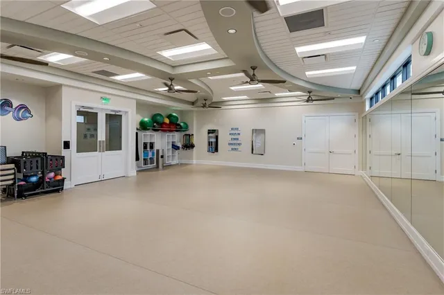 a view of a big room with air conditioner duct and materials on floor